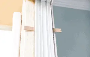 A shim on a door frame